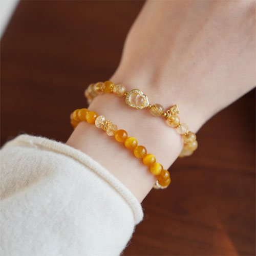 天然の金の髪の晶の腕輪の贈り物の女性の招き招き手串黄水晶