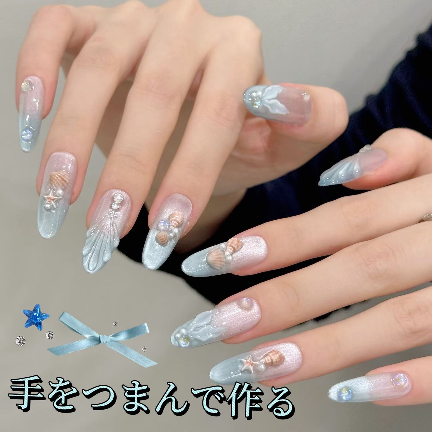 夏の浜の人魚の歌貝の真珠レンガの石の手を握って魚の尾を作ります漸変長楕円甲を着け