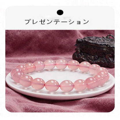 天然の粉の水晶の腕輪女性モザンビークの星明かり粉の晶の水晶の原石の手串桃の花を招き