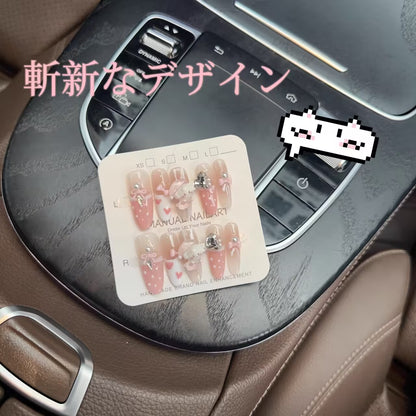 純手制の深い眠り小熊のリボンダイヤモンド装飾の手描きの波点甘くてかわいいユニークな目新しいピンクの楕円を身に着け