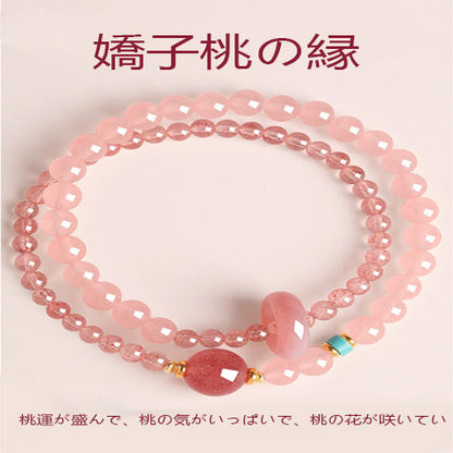 桃の花の天然イチゴの腕輪を招く女性の粉水晶の瀬取り珠精緻な双輪