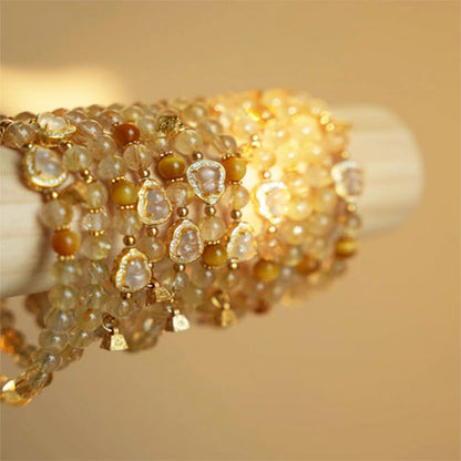 天然の金の髪の晶の腕輪の贈り物の女性の招き招き手串黄水晶