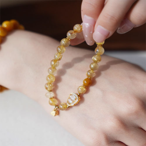 天然の金の髪の晶の腕輪の贈り物の女性の招き招き手串黄水晶