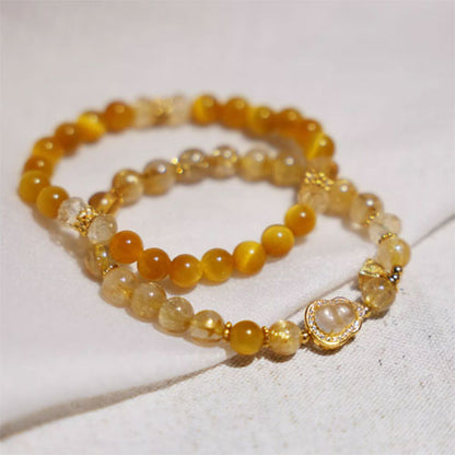 天然の金の髪の晶の腕輪の贈り物の女性の招き招き手串黄水晶