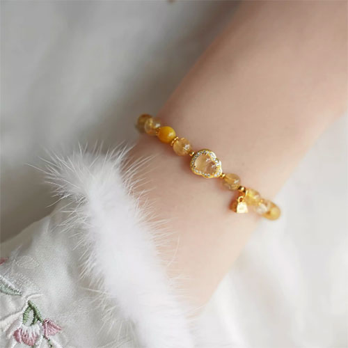 天然の金の髪の晶の腕輪の贈り物の女性の招き招き手串黄水晶