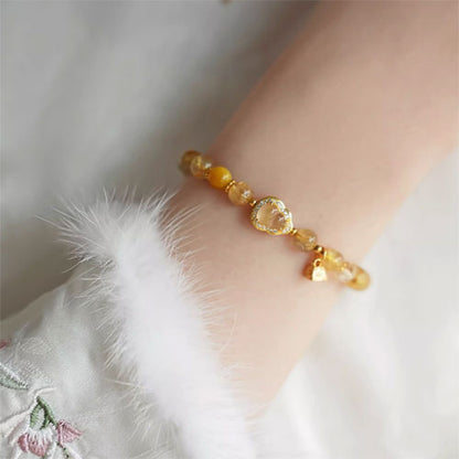 天然の金の髪の晶の腕輪の贈り物の女性の招き招き手串黄水晶