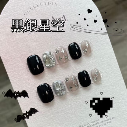 黒銀の星空の四芒星にめまいひらめきダイヤモンドを手でデザインして新しい短い台形を身に着け