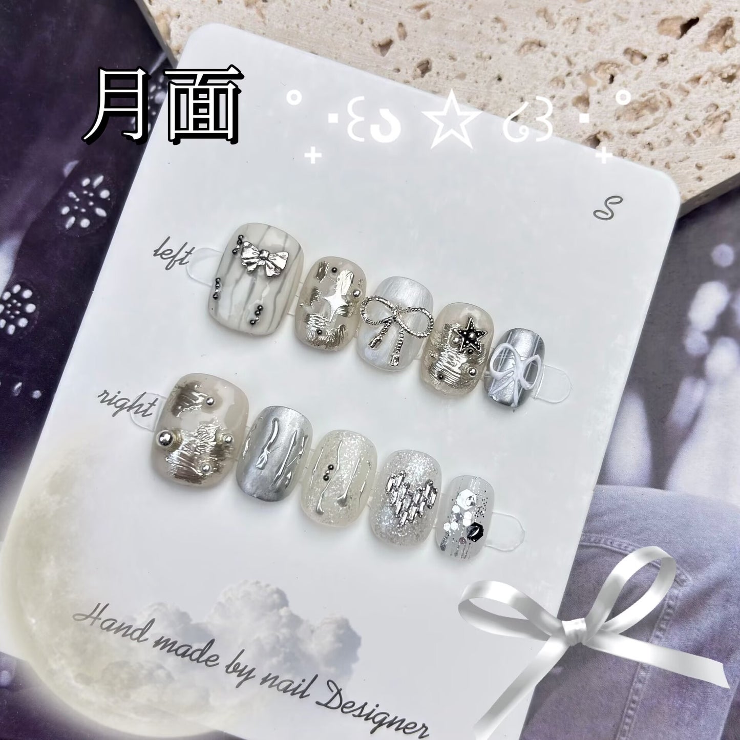 月の表面リボンパールでシルバーを飾り神秘的で高級感があります手描きで短い方円を着けてい