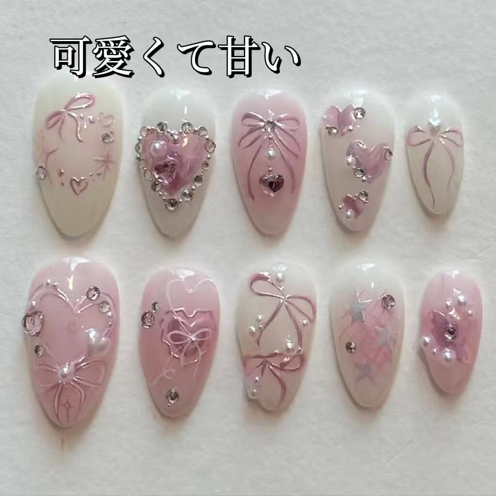 美少女手描きリボン砕いたダイヤが甘くてかわいい水滴形のネイルを飾り