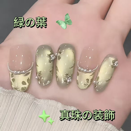 春らしい緑の重工手画猫の目清新な着用甲